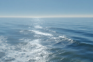 aerial view of ocean surface captures intricate dance of light and shadow across water