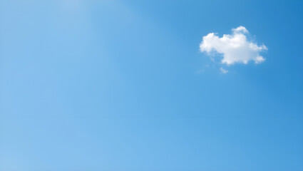 Serene blue sky canvas with a single cloud drifting peacefully in the bright sunny day atmosphere