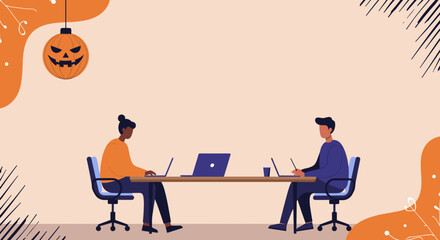 Two diverse colleagues work on laptops at a table, with a festive Halloween jack-o'-lantern enhancing the seasonal office atmosphere. Ideal for business, holiday, and lifestyle themes.
