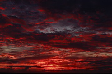Dramatic sunset cloudscape, fiery reds and deep grays