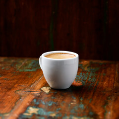 Cup of coffee on wooden background. Soft focus. Copy space	