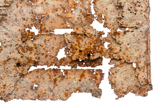 Close up of old piece of rusty iron isolated on white background. Rusty metal surface. Very old piece of sheet metal, rusted through, with holes and ragged edges.