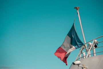 French flag flying on the rear of a ferry