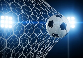 A soccer ball flies into the net during a night game, illuminated by bright stadium lights, symbolizing a winning goal and championship victory