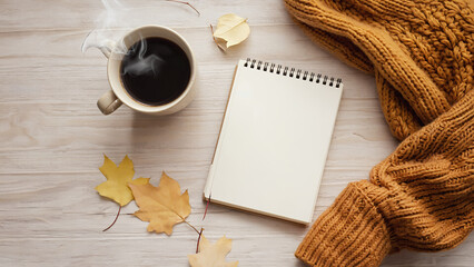 blank notebook with autumn leaves