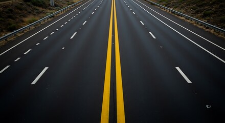 Asphalt road stretches into the distance with double yellow lines dividing lanes, and white dashed lines on the sides.