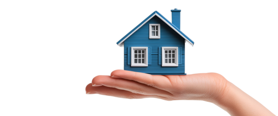Close up of a human hand holding a small blue model house with white windows and chimney isolated on transparent background