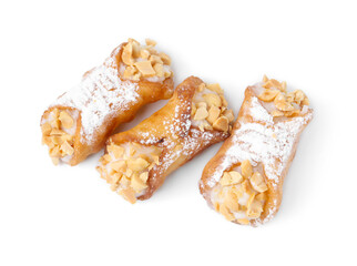 Delicious cannoli with ricotta cheese, peanuts and powdered sugar isolated on white, top view