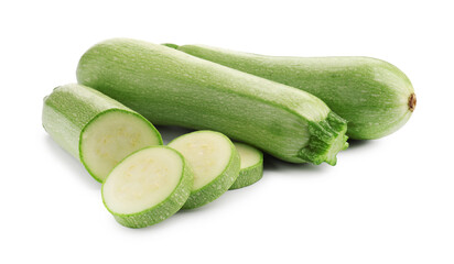Fresh whole and cut zucchinis isolated on white