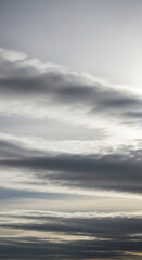 Obraz premium A captivating display of atmospheric conditions unfolds, showcasing a dynamic interplay of clouds and light, creating an ethereal and visually stunning spectacle across the expansive sky.