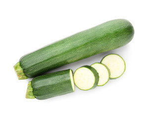 Whole and cut fresh zucchinis isolated on white, top view