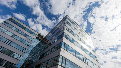 Modern Business. A low angle shot of a modern glass office building against a blue sky with the...