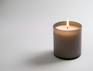 Minimalist Candle with Copy Space on White Background