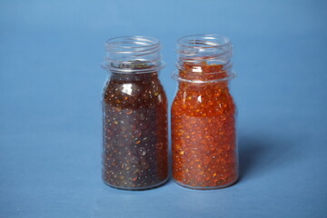 Fresh silica gel orange appears bright orange and dry, while moisture-saturated silica gel turns dark green, showing it has fully absorbed humidity.