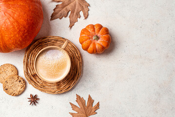 Autumn template. Cup of coffee with pumpkins.