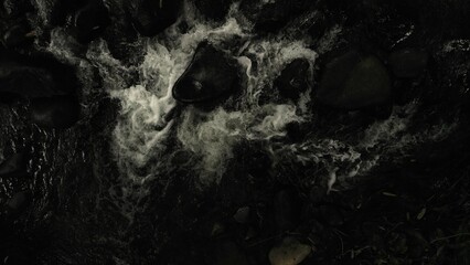 Scenic river with flowing water, rocks, trees, underwater view and sun reflection