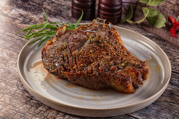 Baked beef steak on the bone