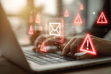 Urgent email alert flashing as person types on laptop, beware of online threats and phishing scams