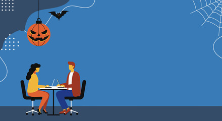 Two colleagues collaborate on laptops in an office, with festive Halloween decorations creating a unique seasonal business environment. Ideal for autumn work concepts or holiday promotions.