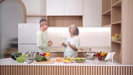 Asian elderly couple preparing healthy meal in modern kitchen home enjoy cooking fresh food wellness lifestyle together - Powered by Adobe