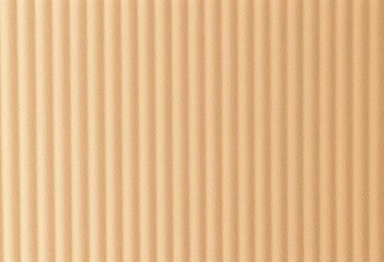 Obraz premium Close-up of corrugated cardboard showing its ridged texture and subtle light and shadow play, abstract, structure