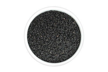 Nigella sativa or Black cumin in ceramic bowl isolated on white background. Top view. Flat lay.