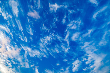 blue sky with feathery clouds