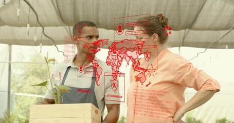 Coworkers carrying crate and tapping red map overlay glitching hologram during greenhouse review - Powered by Adobe