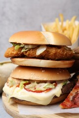 Different delicious fast food on table, closeup