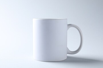White mug on light background. Mockup for design