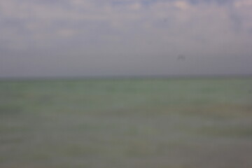 A dreamy view of the horizon line over the calm waters.