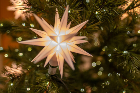 beautifully decorated Christmas tree with red and gold ornaments, twinkling lights, and reflective disco balls, capturing festive holiday cheer, Holiday magic, Winter wonderland