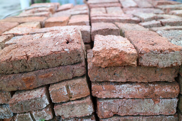 Stack of Weathered Red Bricks