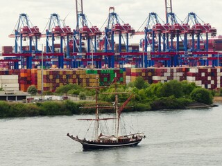 A sailing ship in the container port in Hamburg