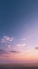 A tranquil twilight sky showcasing vibrant clouds over a serene horizon with a peaceful sunset atmosphere.
