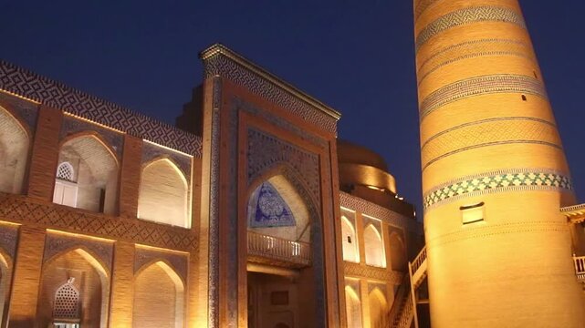 Khiva, Uzbekistan, a panoramic view of the Islam Khodja Madrasa with its very high minaret at night, UNESCO World Heritage Site