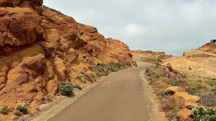 A Scenic Pathway That Winds Through Stunning Red Rock Terrain Awaits Adventurers