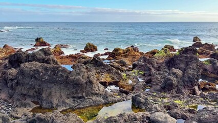 A Serene Coastal Rock Formation Offering Breathtaking Views of the Expansive Ocean