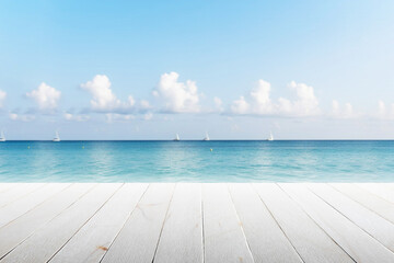 Fototapeta premium Empty wooden floor at the edge of the beach in blurred sea background