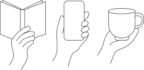hand with a book, phone and cup