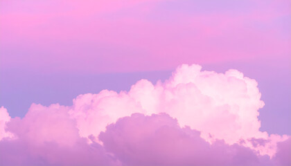 Pastel pink sky with fluffy cumulus clouds.