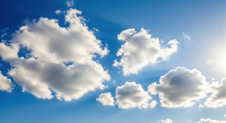 Obraz premium Bright Blue Sky with Fluffy White Clouds in Natural Sunlight