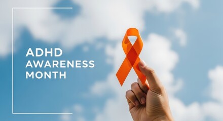 bright orange ribbon held against clear blue sky symbolizes adhd awareness month. message of support. educational campaign, mental health initiative. attention deficit hyperactivity disorder