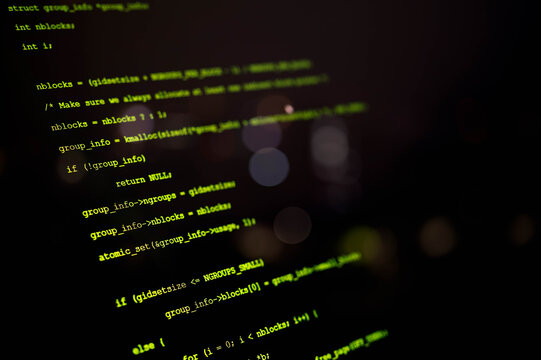 Close-up view of computer programming code on a dark screen, representing software development, cybersecurity, coding, and IT technology in a modern digital environment. - Powered by Adobe