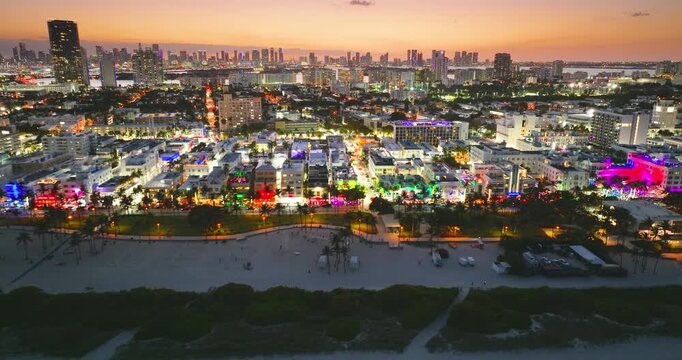 Ocean Drive street at sunset in Miami Beach, Florida. Tourist infrastructure in popular travel destination place.