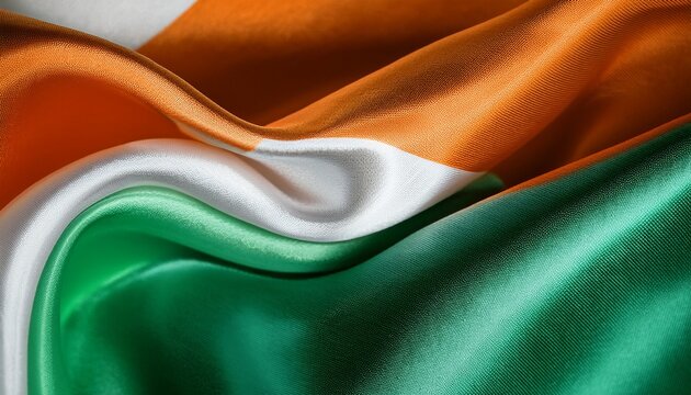 fabric waves of ireland a close up capture of flowing silk fabric a tri color dance of emerald ivory and vibrant orange evoking the spirit of the emerald isle