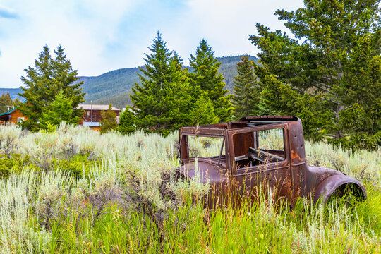 Fototapeta Rusty Vintage Car with Bullet Holes at Elkhorn Ghost Town, Montana