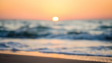 Serene beach sunset with golden tones and a softly focused horizon, creating a peaceful atmosphere.