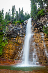 Scenic Virginia waterfall close up in Glacier National Park on summer day