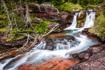 Baring Creek waterfalls on Siyeh Pass Trail in Glacier National Park